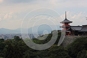 View of SanjÃÂ«nodÃÂ pagoda highest pagoda in Japan with 31 m. high with Kyoto city on background, Kiyomizu-dera temple, Kyoto. photo